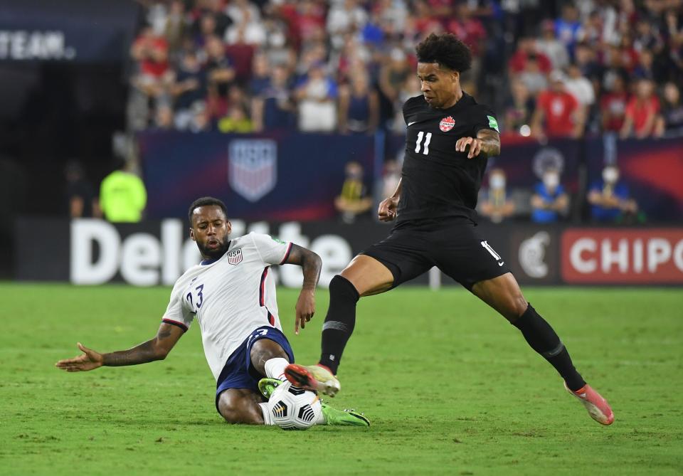 Sep 5, 2021; Nashville, Tennessee, USA; United States midfielder Kellyn Acosta (23) against Canada forward Tajon Buchanan (11)during a CONCACAF FIFA World Cup Qualifier soccer match at Nissan Stadium.