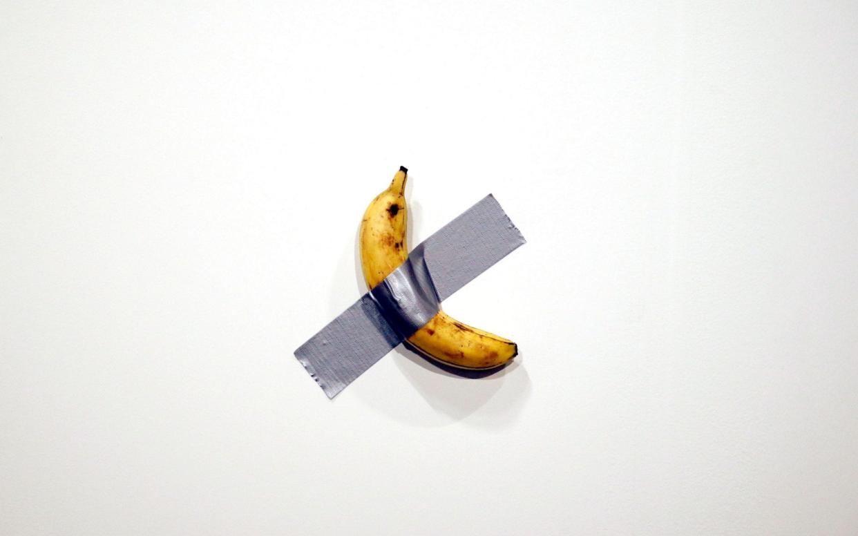 The banana, by Italian artist Maurizio Cattelan, is intended to symbolise global trade  - REX