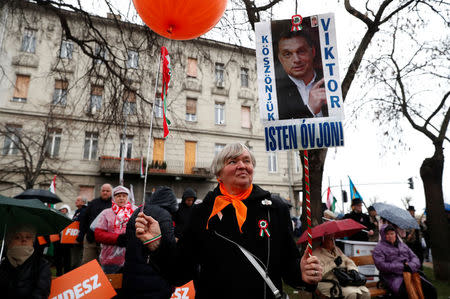 FILE PHOTO - A woman attends Hungarian march at a pro-Orban rally during Hungary's National Day celebrations, which also commemorates the 1848 Hungarian Revolution against the Habsburg monarchy, in Budapest, Hungary March 15, 2018. REUTERS/Bernadett Szabo