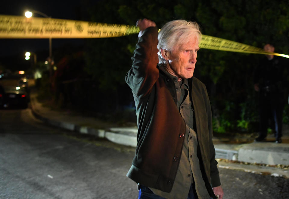 Matthew Perry's stepfather, Keith Morrison, crosses the police tape down the street from Perry's house in Pacific Palisades, Oct. 28, 2023. / Credit: Wally Skalij/Los Angeles Times via Getty Images