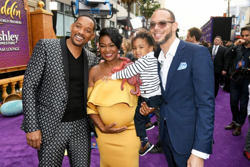 Will Smith with Tatyana Ali and her family | Kevin Winter/Getty