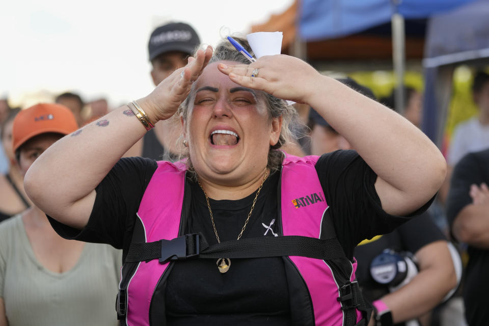 A volunteer reacts during a search and rescue operation from an area flooded by heavy rains in Porto Alegre, Brazil, Tuesday, May 7, 2024. (AP Photo/Andre Penner)