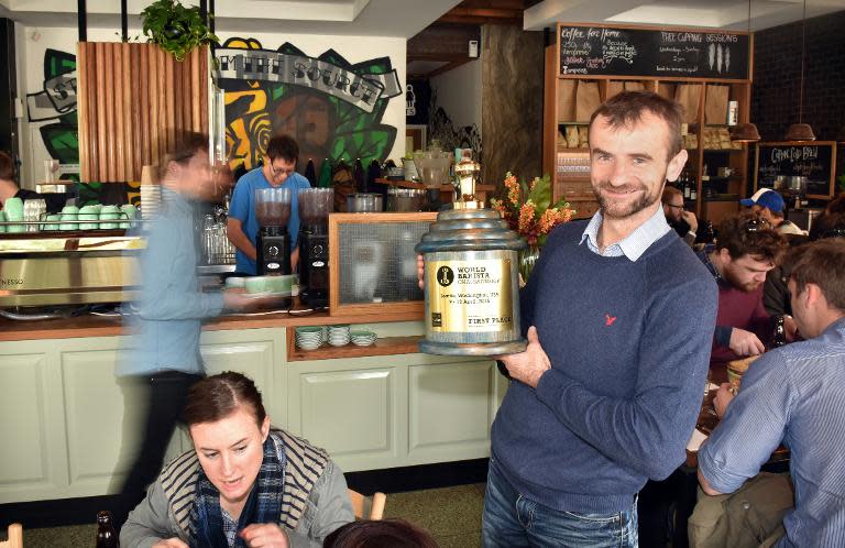 Coffee maker Sasa Sestic with his World Barista Championship trophy at his cafe in Canberra