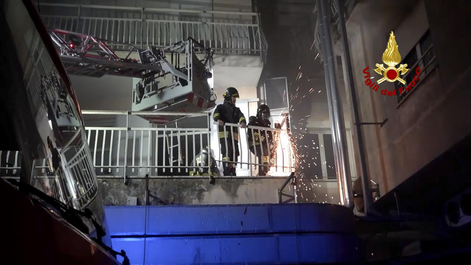 Italian Firefighters work on the balcony of a building of the San Giovanni Evangelista Hospital after a fire broke out causing the death of four people in Tivoli, Italy Friday, Dec. 8, 2023. (Italian Firefighters Via AP)