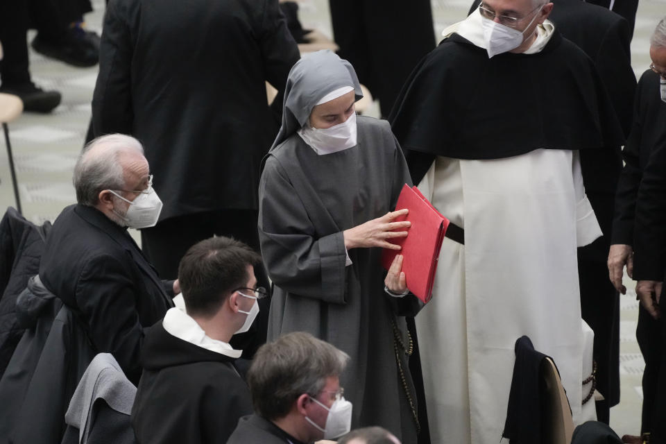 Nuns and priests attend the opening of a 3-day Symposium on Vocations in the Paul VI hall at the Vatican, Thursday, Feb. 17, 2022. (AP Photo/Gregorio Borgia)