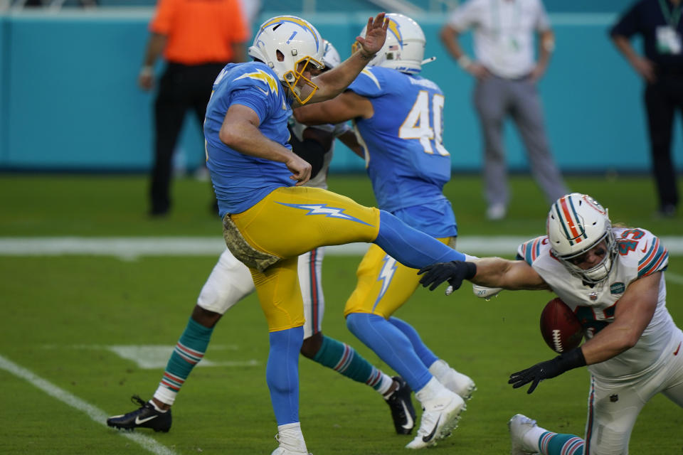 Miami Dolphins outside linebacker Andrew Van Ginkel (43) blocks a punt by Los Angeles Chargers punter Ty Long (1), during the first half of an NFL football game, Sunday, Nov. 15, 2020, in Miami Gardens, Fla. (AP Photo/Wilfredo Lee)