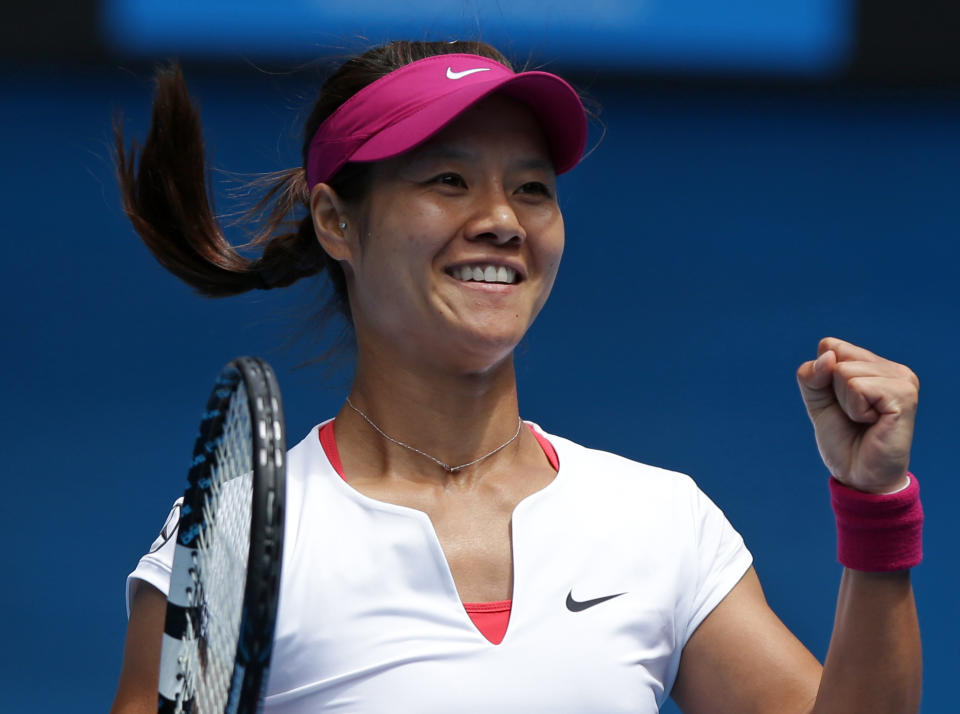 Li Na of China celebrates after defeating Flavia Pennetta of Italy during their quarterfinal at the Australian Open tennis championship in Melbourne, Australia, Tuesday, Jan. 21, 2014. (AP Photo/Aaron Favila)