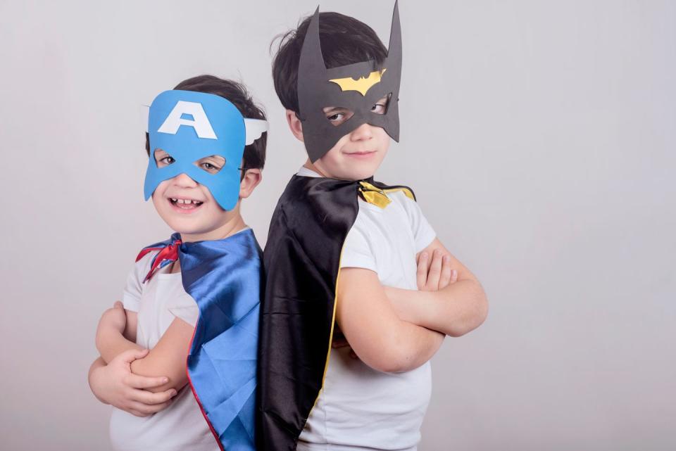 <p>Sure, this costume mixes the DC Comics and Marvel universes — but what's a parent to do when the kids can't make up their mind? DIY a paper mask, give them both a cape and let them tailor it to their liking. </p>