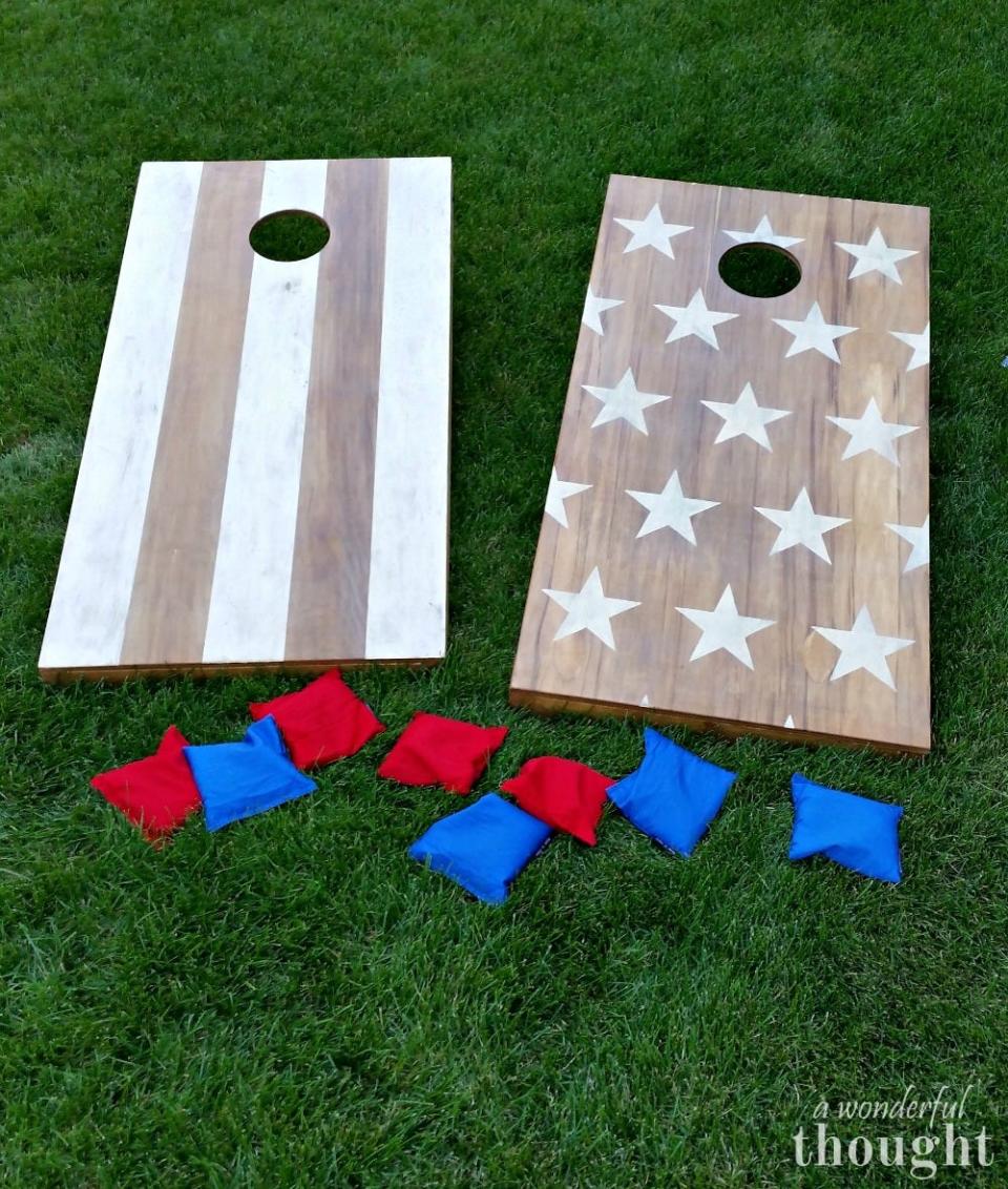 <p>Bean bag toss is a fun party game for kids and adults alike, and making your own patriotic cornhole boards is easier than you think. </p><p><strong><em>Get the tutorial from <a href="https://awonderfulthought.com/diy-cornhole-boards/" rel="nofollow noopener" target="_blank" data-ylk="slk:A Wonderful Thought;elm:context_link;itc:0;sec:content-canvas" class="link ">A Wonderful Thought</a>.</em></strong></p>