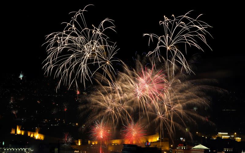 Fireworks explode over Skopje during the New Year celebrations
