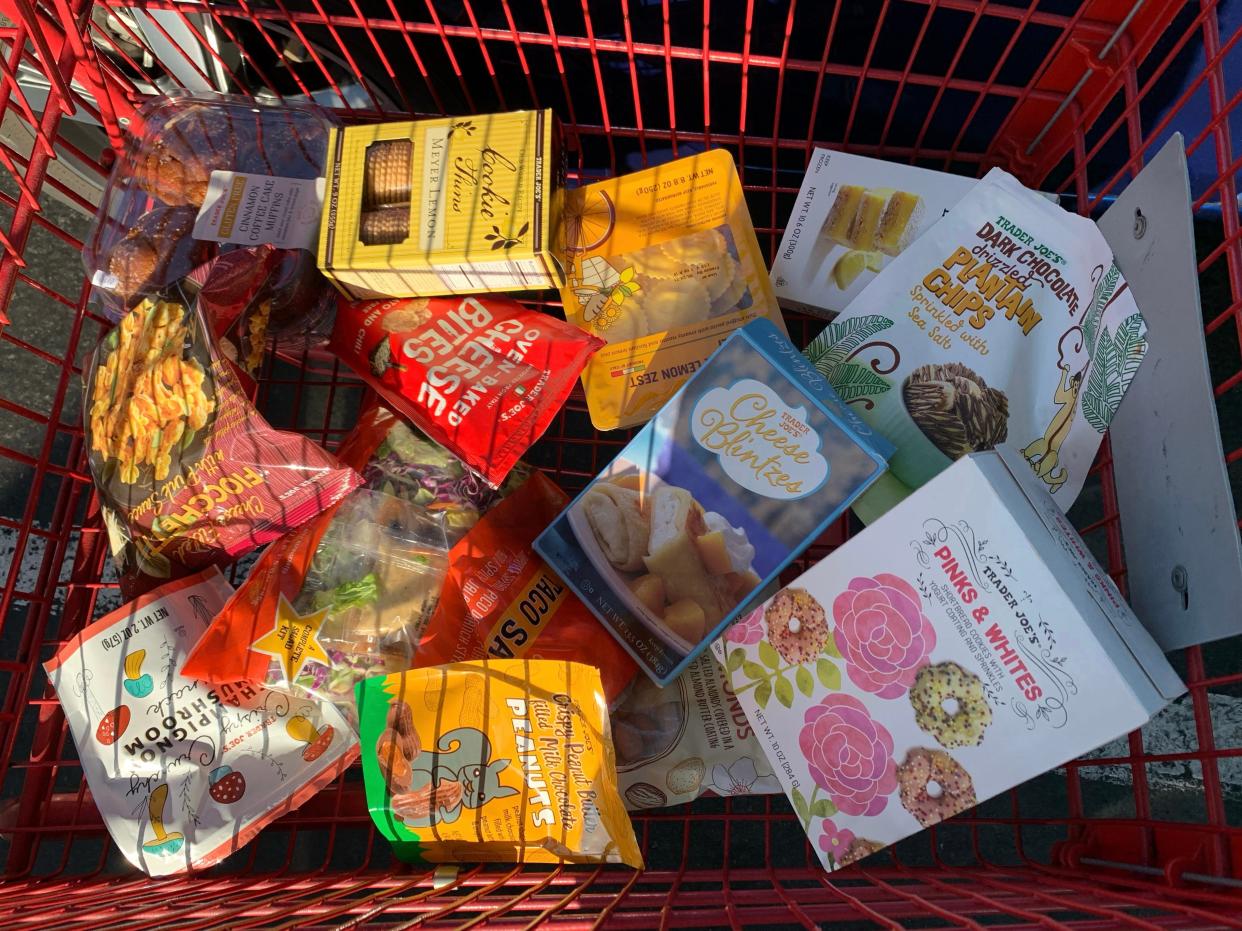 a red shopping cart with a spring trader joe's haul