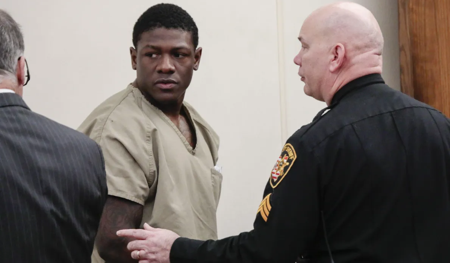 Former Ohio State football player Jahsent Wint looks back to his attorney, Sam Shamansky, left, after his arraignment in February 2020 in Franklin County Municipal Court on charges alleging he and teammate Amir Riep raped a then-19-year-old woman on Feb. 4, 2020 in an apartment the two men shared.