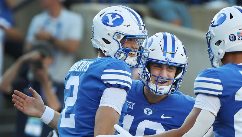 Brigham Young Cougars wide receiver Chase Roberts (2) celebrates his touchdown with quarterback Kedon Slovis (10) against the Texas Tech Red Raiders in Provo on Saturday, Oct. 21, 2023. BYU won 27-14.