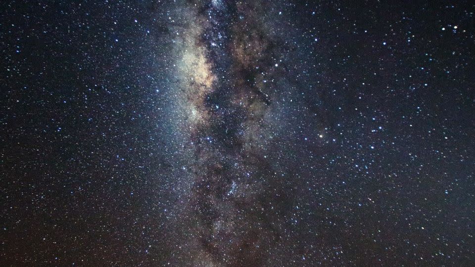 A Masaai man watches the stars, while nearby elephants look on. - Daniel Chu Owen, Travelling Telescope