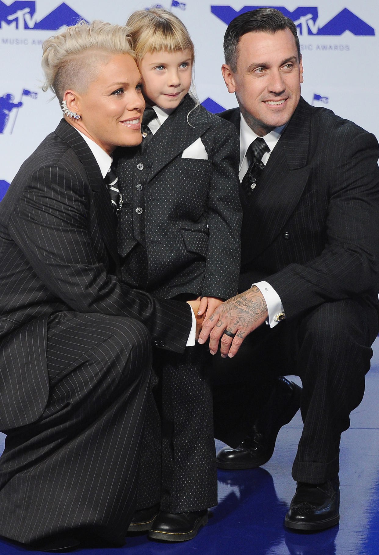 Eleven-year-old Willow (center) alongside her parents Pink and Carey Hart.  (Getty Images)