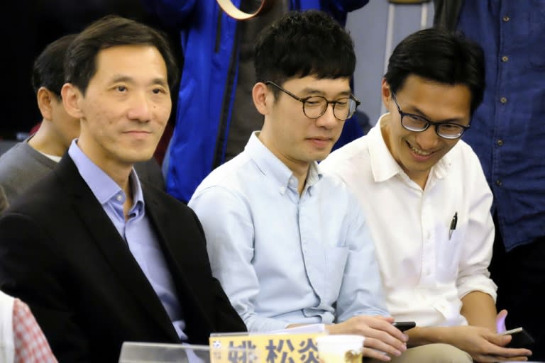 (L-R) Hong Kong politicians Edward Yiu, Nathan Law and Eddie Chu attend a political forum hosted by Taiwan's grassroot New Power Party in Taipei on January 7, 2017