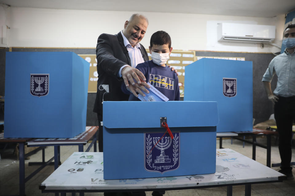 Mansour Abbas, leader of the United Arab List, votes for Israel's parliamentary election at a polling station in Maghar, Israel, Tuesday, March. 23, 2021. Israel is holding its fourth election in less than two years. (AP Photo/Mahmoud Illean)