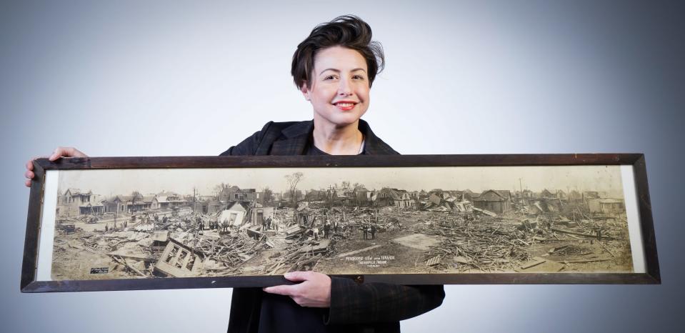 IndyStar Multimedia Reporter Michelle Pemberton holds an original panoramic print taken by photographers 	
Starkey and Brown, (715 Mass Ave., Indianapolis,) of the 1927 tornado which barreled through Indianapolis' east side. Pemberton purchased the vintage print at an antique store in Kirklin Ind.