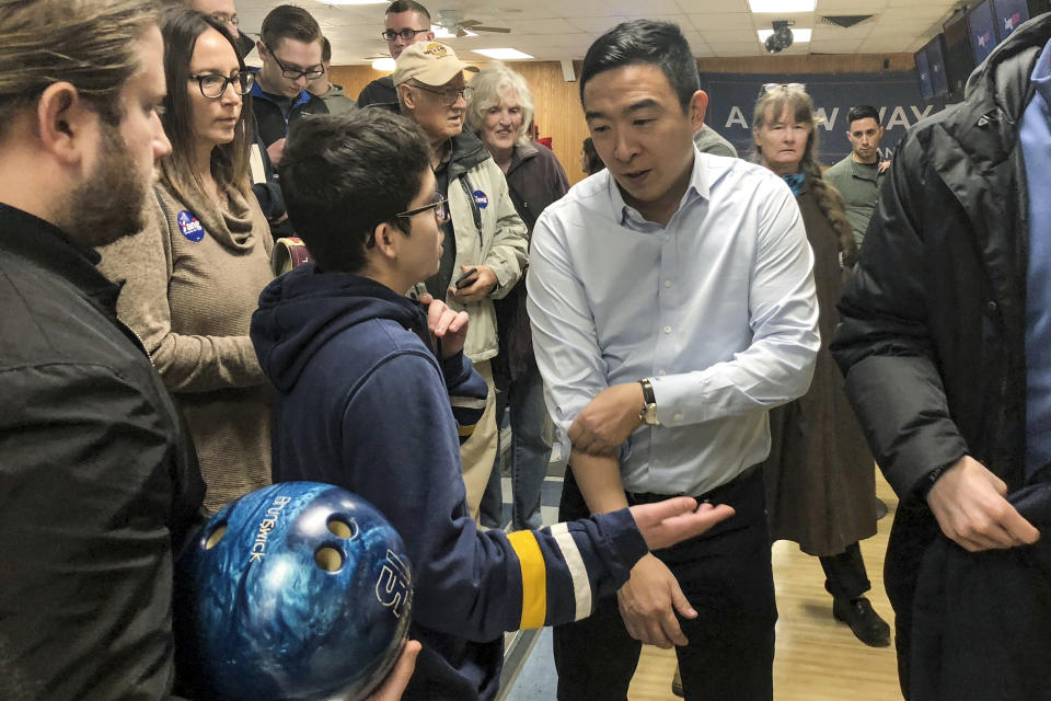 In this Monday Jan. 6. 2020 photo, Democratic presidential candidate Andrew Yang gets ready to bowl following a campaign event in Clinton, Iowa. (AP Photo/Sara Burnett)