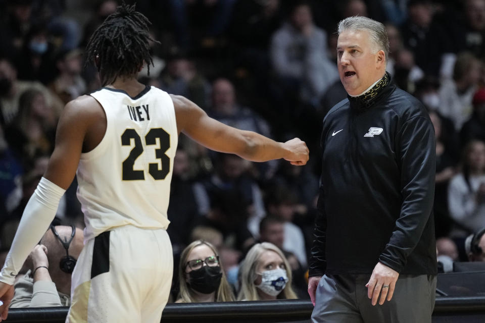 Purdue head coach Matt Painter, right, talks with his player Jaden Ivey while their team played Nebraska in the second half of an NCAA college basketball game in West Lafayette, Ind., Friday, Jan. 14, 2022. Purdue won 92-65. (AP Photo/AJ Mast)