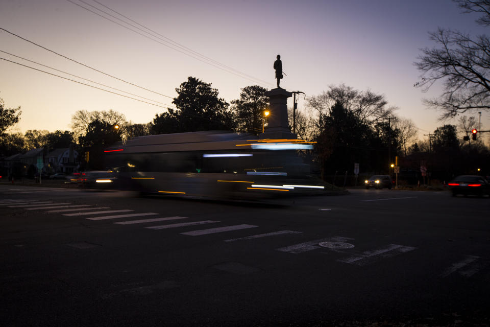 Morning rush hour passes at the intersection of W. Laburnum Ave. and Hermitage Road by the statue of Confederate Lieutenant General A.P. Hill, Monday, Dec. 12, 2022 in Richmond, Va. (AP Photo/John C. Clark)