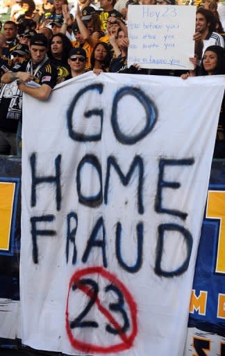 LA Galaxy fans hold up a sign during a match in 2009 in a protest against David Beckham. Beckham's loans to European teams angered some LA fans who displayed their dislike with signs at games that said "Go home fraud" and "Part time player"