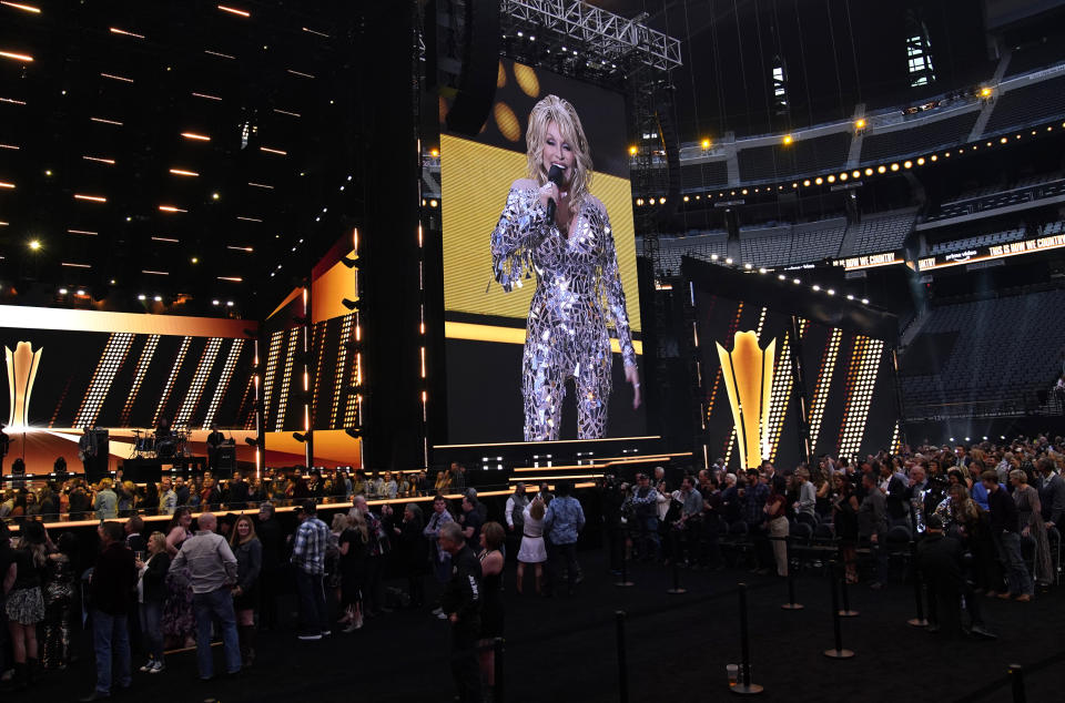 Host Dolly Parton speaks at the 57th Academy of Country Music Awards on Monday, March 7, 2022, at Allegiant Stadium in Las Vegas. (AP Photo/John Locher)