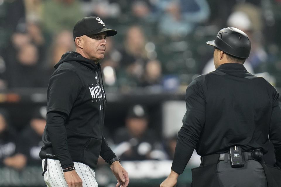 Chicago White Sox manager Pedro Grifol, left, talks to an umpire during the third inning of a baseball game against the Houston Astros, Friday, May 12, 2023, in Chicago. (AP Photo/Erin Hooley)