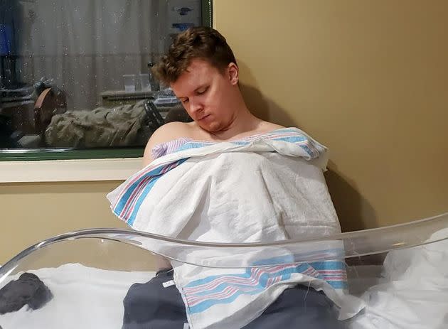 The writer's husband doing skin-to-skin contact with their youngest son in a Marietta, Georgia, hospital. (Photo: Courtesy of Gillan Ritchie)