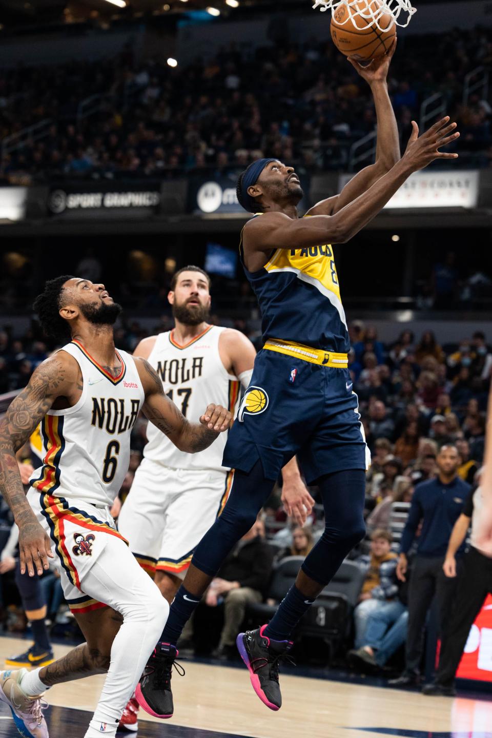 Nov 20, 2021; Indianapolis, Indiana, USA; Indiana Pacers forward Justin Holiday (8) shoots the ball while New Orleans Pelicans guard Nickeil Alexander-Walker (6) defends in the first half at Gainbridge Fieldhouse. Mandatory Credit: Trevor Ruszkowski-USA TODAY Sports