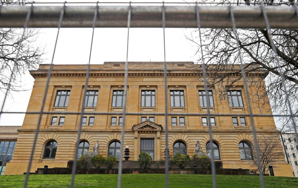 In preparation for the special grand jury hearing to review the Akron police shooting of Jayland Walker, workers installed guard rails around the perimeter of the Summit County Courthouse.