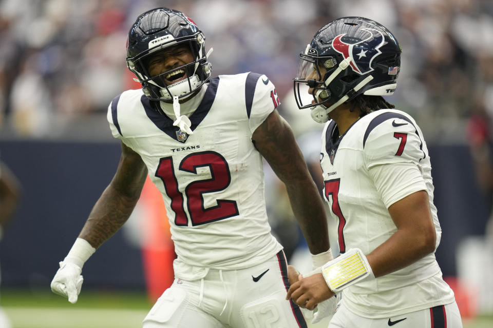 Houston Texans quarterback C.J. Stroud (7) celebrates a touchdown pass to wide receiver Nico Collin (12) in the first half of an NFL football game against the Indianapolis Colts in Houston, Sunday, Sept. 17, 2023. (AP Photo/Eric Christian Smith)