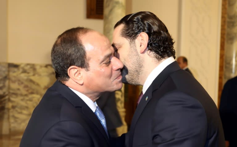 A handout picture provided by the Lebanese photo agency Dalati and Nohra on November 21, 2017 shows Lebanese Prime Minister Saad Hariri (R) being greeted by Egyptian President Abdel Fattah al-Sisi (L) upon his arrival in Cairo