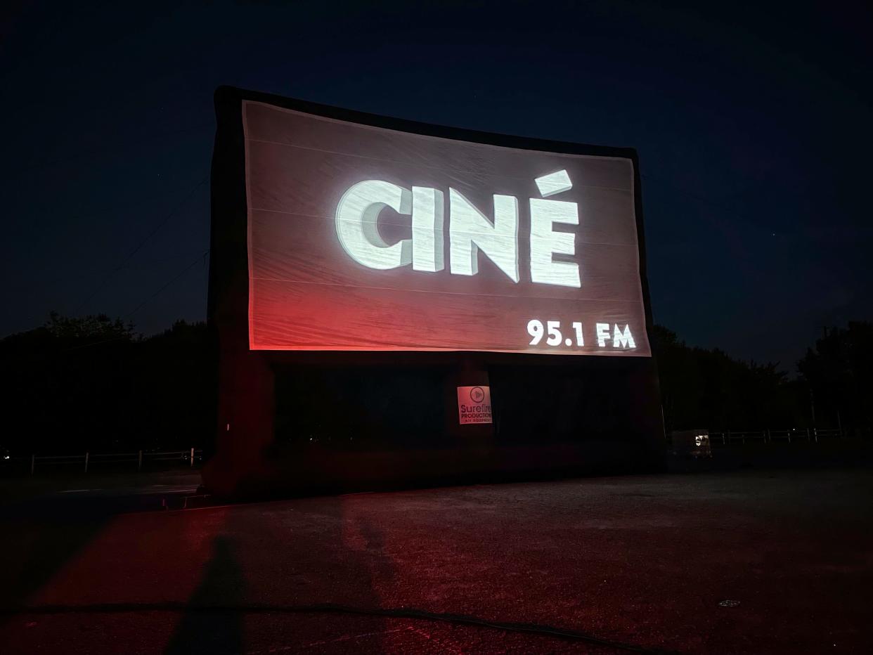 The logo for nonprofit art theater and event venue Ciné appears on their pop-up drive-in screen at General Time Athens on Sept. 27, 2022.