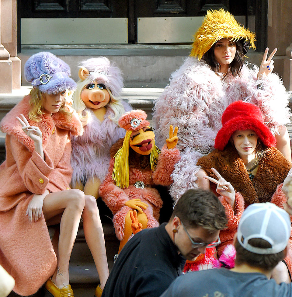 <p>The model had some colorful, furry co-stars during a photo shoot in New York City’s West Village for <i>Love</i> magazine. It was the Muppets — who happen to resemble some of the looks from designer brand Miu Miu’s upcoming line. (Photo: Josiah Kamau/BuzzFoto via Getty Images) </p>
