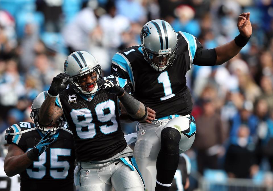 Teammates Steve Smith #89 of the Carolina Panthers and Cam Newton #1 celebrate after a touchdown during their game against the Oakland Raiders at Bank of America Stadium on December 23, 2012 in Charlotte, North Carolina. (Photo by Streeter Lecka/Getty Images)