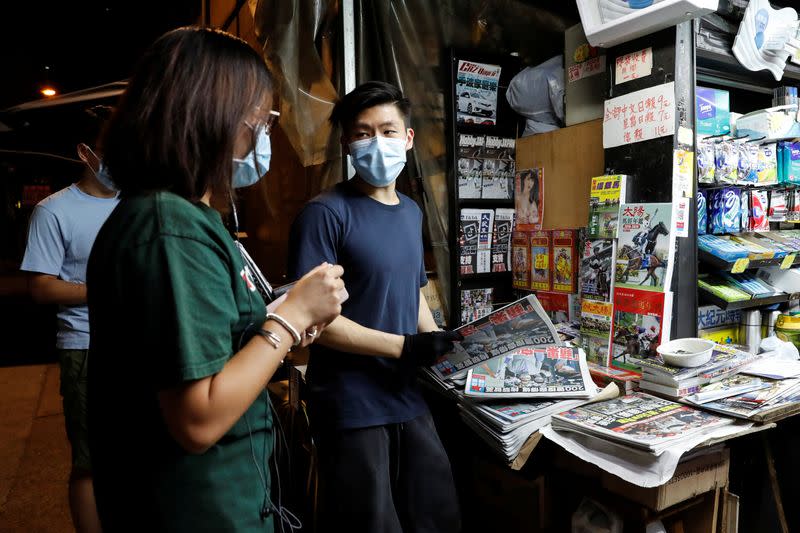 Supporters of Apple Daily newspaper, queue up to buy a copy of Apple Daily newspaper to support media mogul Jimmy Lai Chee-ying, founder of Apple Daily after he was arrested by the national security unit, in Hong Kong