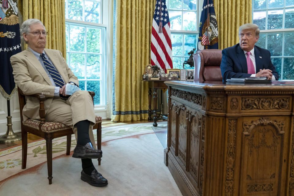 Senate Majority Leader Mitch McConnell of Ky., listens as President Donald Trump speaks during a meeting in the Oval Office of the White House, Monday, July 20, 2020, in Washington. (AP Photo/Evan Vucci)