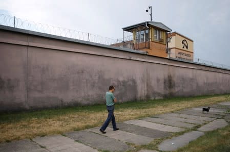 A man walks outside of the Bialoleka prison in Warsaw