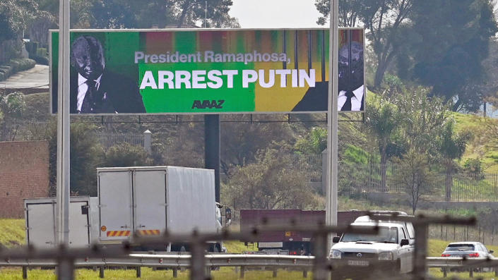 A billboard urging South Africa&#39;s president to arrest Mr Putin if he comes for the Brics summit - March 2023