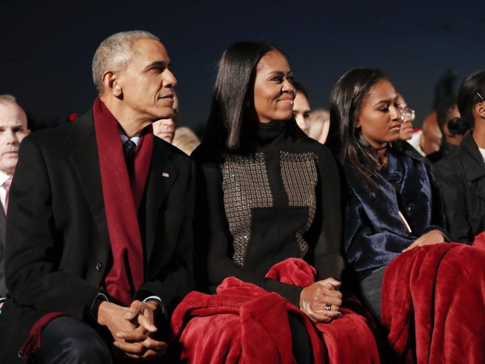 From left: former President Barack Obama, daughter Sasha Obama and former First Lady Michelle Obama in December 2016 | AP Photo/Pablo Martinez Monsivais