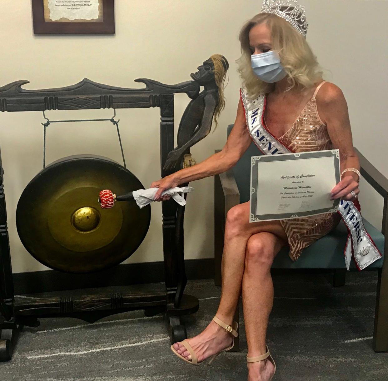 Marianne Hamilton, who recently won the Ms. Senior Universe title, celebrates by ringing the ‘last chemo treatment’ gong at the Intermountain Cancer Center in St. George on May 11.