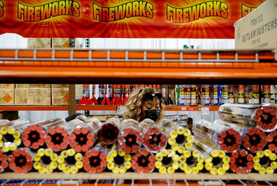 Khatera Johnson shops for fireworks inside Fireworks Outlet OKC in Valley Brook, Thursday, July 1, 2021.