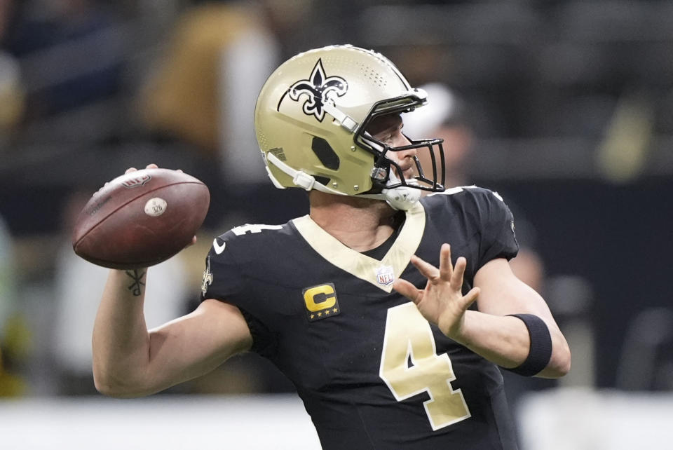 New Orleans Saints quarterback Derek Carr (4) warms up before an NFL football game against the Atlanta Falcons in New Orleans, Sunday, Jan. 7, 2024. (AP Photo/Gerald Herbert)
