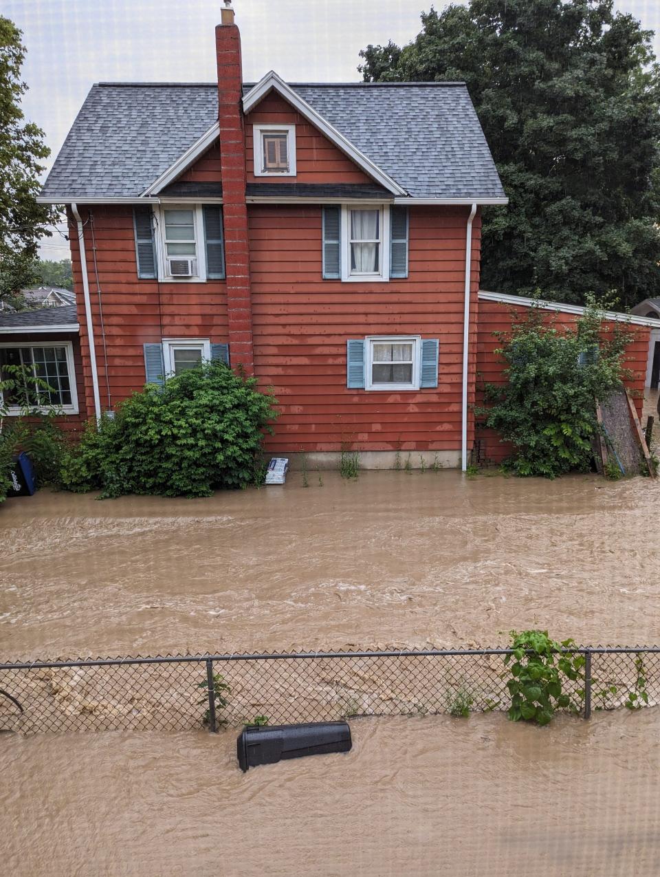 Flood waters rise on Sunday at this West Gibson Street, Canandaigua home.