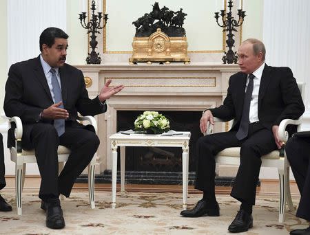 Russian President Vladimir Putin (R) meets with his Venezuelan counterpart Nicolas Maduro at the Kremlin in Moscow, Russia October 4, 2017. REUTERS/Yuri Kadobnov/Pool