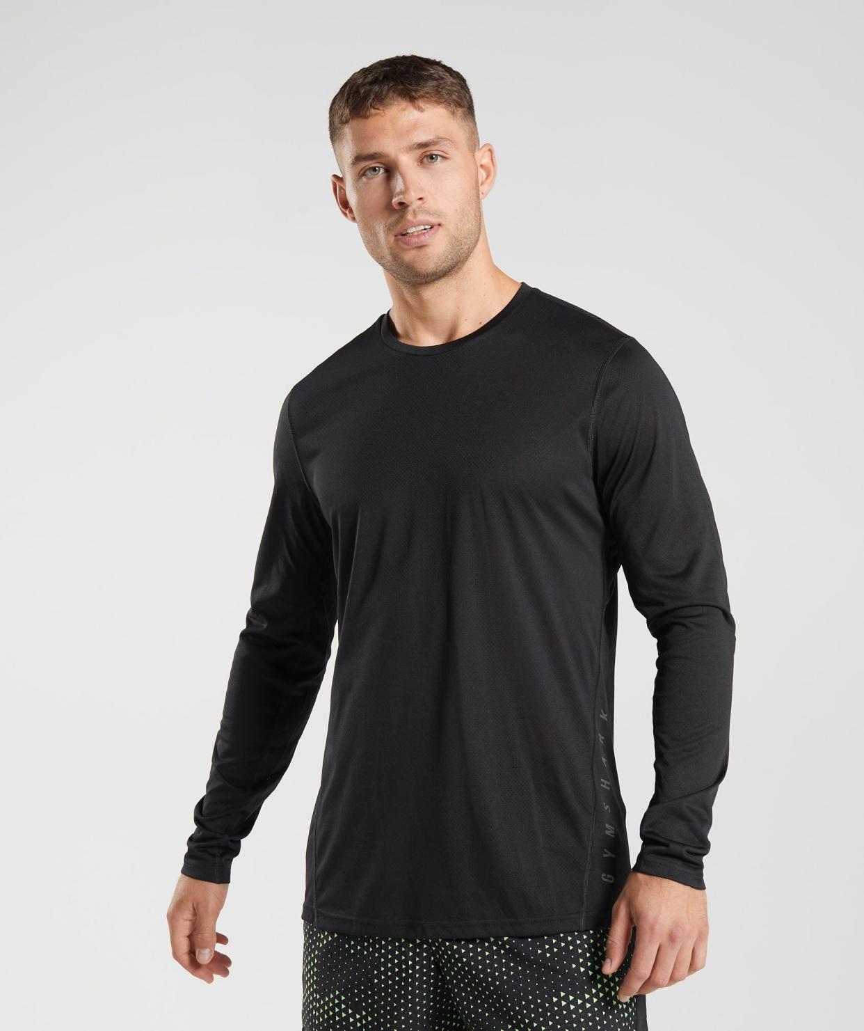 <p><a href="https://go.redirectingat.com?id=74968X1596630&url=https%3A%2F%2Fuk.gymshark.com%2Fproducts%2Fgymshark-sport-long-sleeve-t-shirt-black-black-marl-aw22&sref=https%3A%2F%2F" rel="nofollow noopener" target="_blank" data-ylk="slk:Shop Now;elm:context_link;itc:0;sec:content-canvas" class="link rapid-noclick-resp">Shop Now</a></p><p>Sport Long Sleeve T-Shirt</p><p>gymshark.com</p><p>£25.00</p>