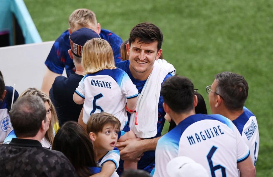 Maguire celebrates with family after England’s opening 6-2 win over Iran (Getty)