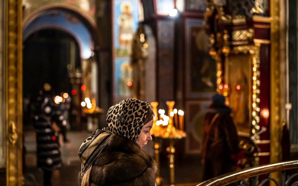 Worshippers at St. Michael's Monastery of the Orthodox Church in Kyiv - Chris Strickland