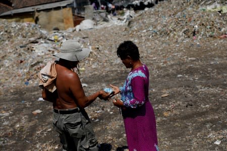 The Wider Image: Cash for trash: Indonesia village banks on waste recycling